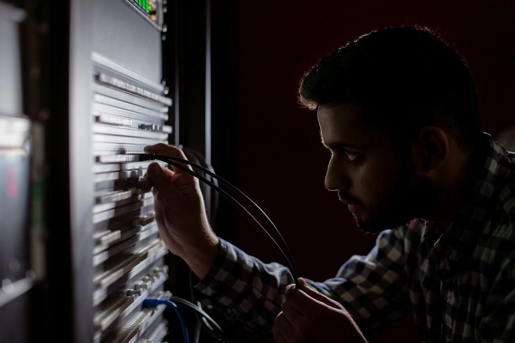 Tsinghua’s AKV Cuts AI Agent Costs by 27.7% with KV Cache Engineering | StartMit Server racks with glowing status lights in a data center where AI agents and their KV caches run