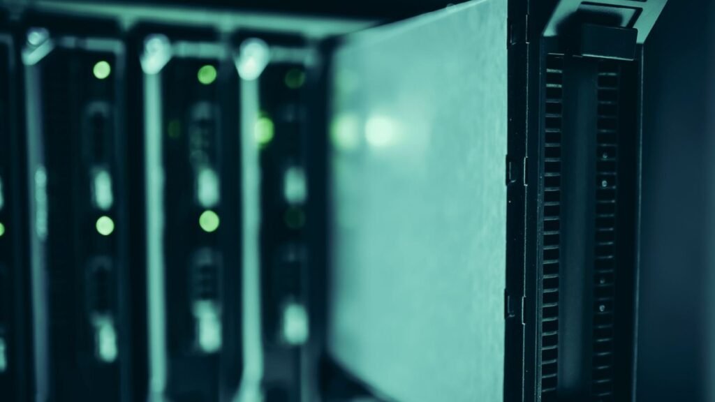 70 Prozent günstiger, aber lohnt sich das? Was MiniMax M3.1 Flash für deutsche Agent-Workflows wirklich kostet | StartMit Server racks in a data center with green status lights — the inference infrastructure behind AI agent costs